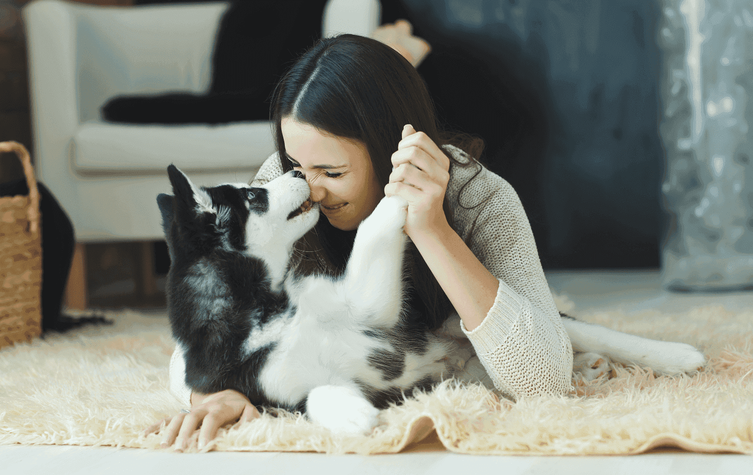 a woman and her dog at home